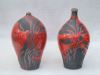 Raku vazen met rood glazuur ongeveer 30 cm hoog. Rechtervaas is in particulier bezit
